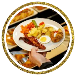 Assorted buffet dishes with BBQ sides and condiments arranged on a serving table